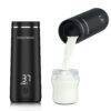 Baby Brezza SuperFast Portable Warmer in black, showcasing the warming feature with milk pouring from the container.