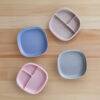 b.box silicone plates in blush and ocean colors, featuring a divided design for easy food storage and serving.