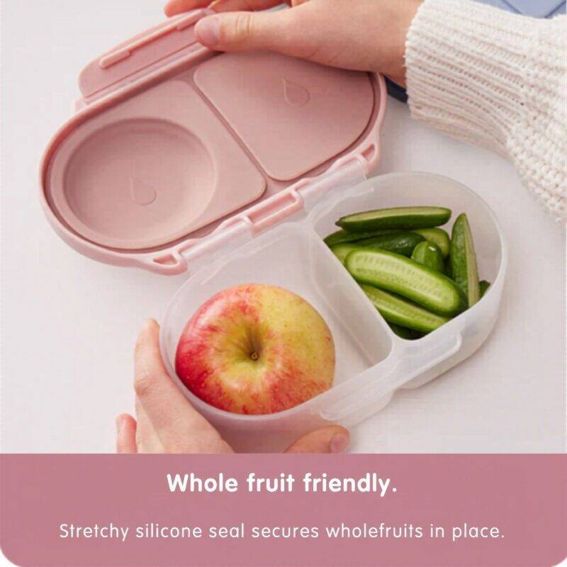 b.box snackbox in blue slate with a pink lid, featuring a stretchy silicone seal for securing whole fruits.