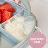 b.box silicone plate in blush with easy scoop sides, featuring a green spoon and strawberries on the side.