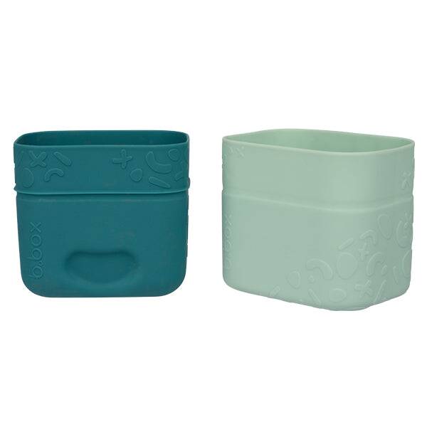 b.box silicone snack cup in forest green and light mint, featuring a soft, flexible design for easy gripping.