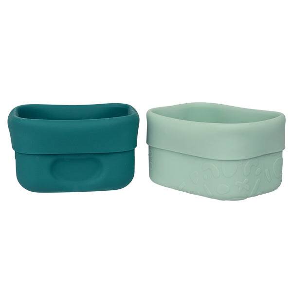 b.box silicone snack cup in forest green and mint, featuring a soft, flexible design for easy handling.