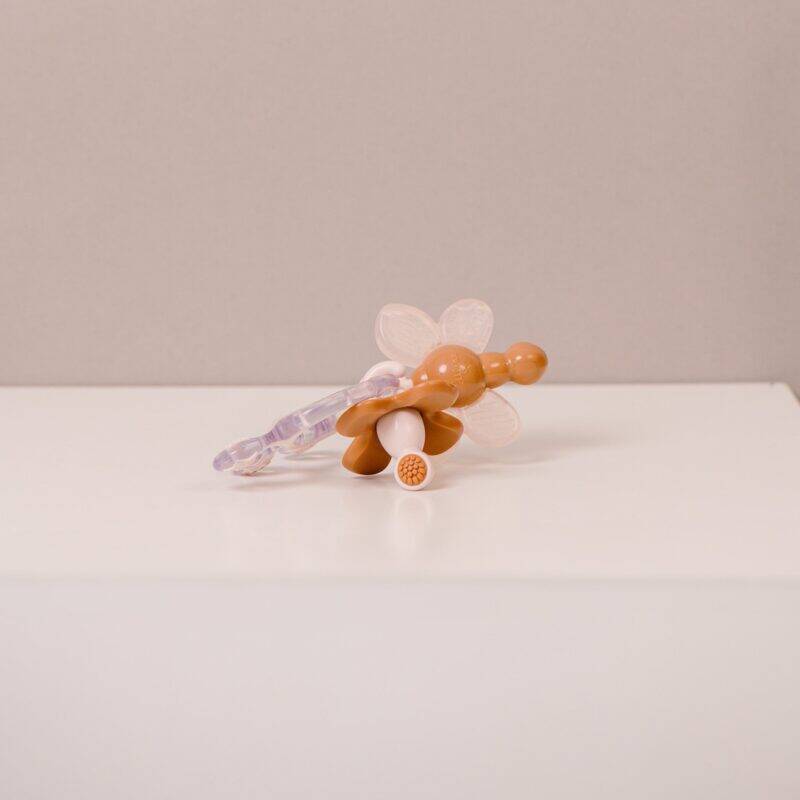 Difrax Crown Teething Ring in soft pastel colors with flower and crown design, ideal for soothing teething babies.