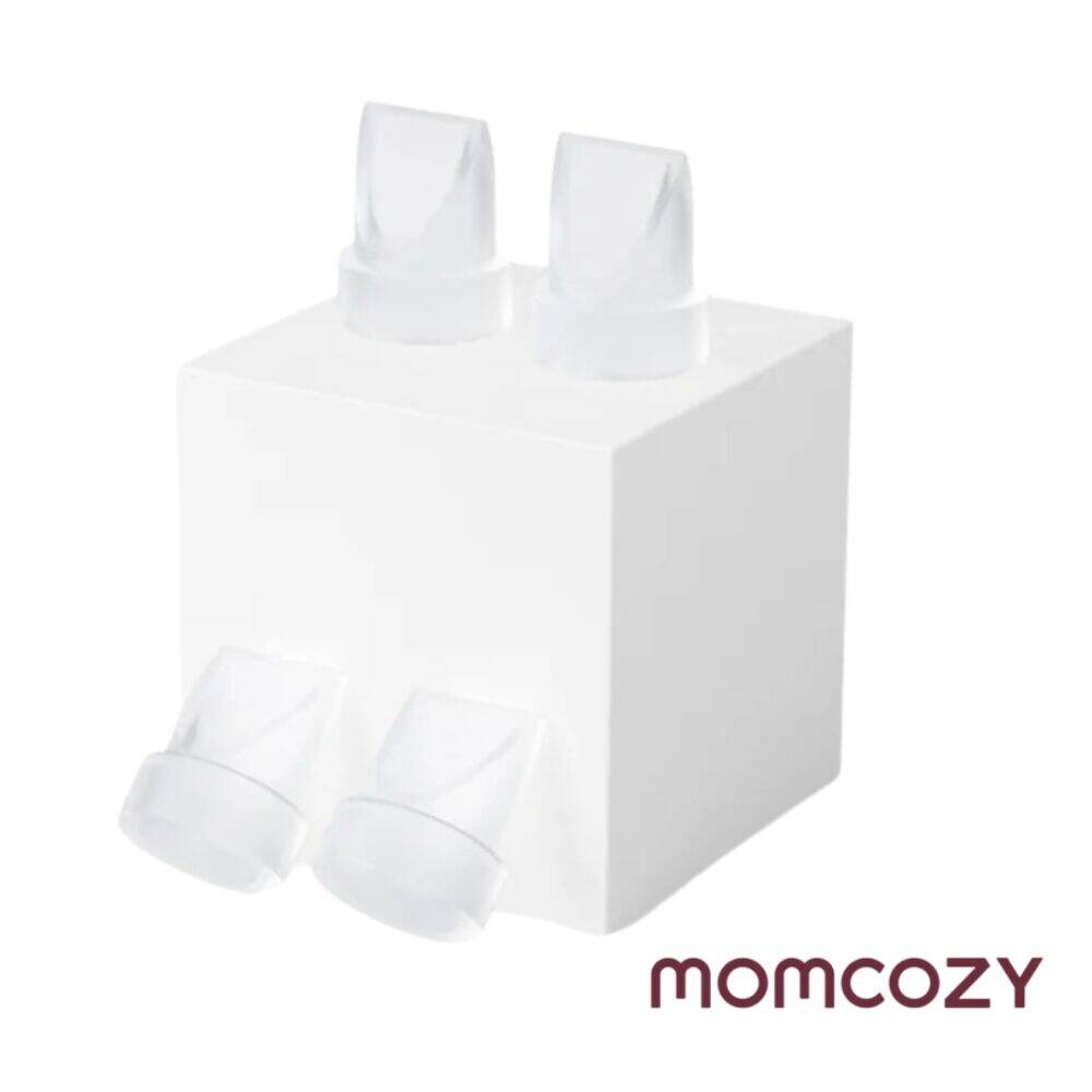 Momcozy M6 Duckbill Valves - 4 pack, clear silicone valves displayed on a white cube, designed for breast pumps.