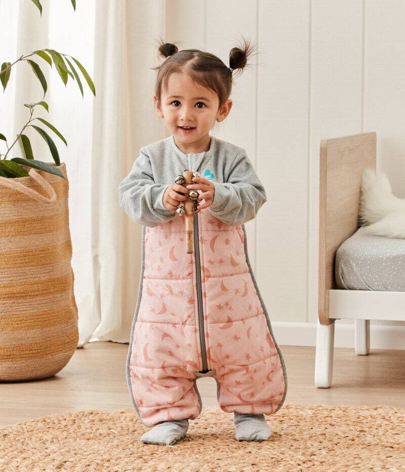 Love to Dream long sleeve sleep suit in Moonlight Dusty, featuring a zip front and cozy design, worn by a toddler.