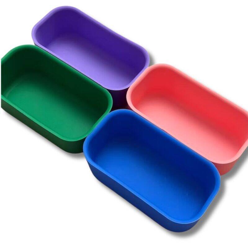 Junary Balanced Bites Bento set featuring four rectangular silicone containers in azure, evergreen, peach, and violet.
