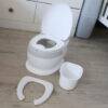 Snuggletime Comfort Toilet Seat Potty in white with removable inner bucket and soft padded seat for comfort.