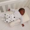 Snuggletime Bamboo Inclined to Sleep, featuring a baby resting comfortably on a soft incline in a crib.