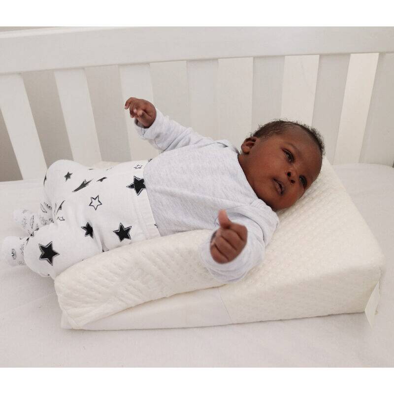 Snuggletime Bamboo Inclined to Sleep, featuring a baby comfortably resting on a supportive incline in a crib.