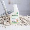 BabySafe Floor & Tile Deep Cleaner Concentrate 500ml with eco-friendly label, displayed next to a mop on a clean surface.