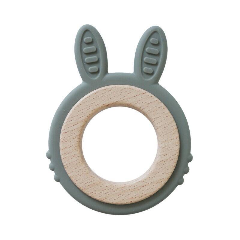 Back To Nature Teether Ring in green with pink rabbit ears and a wooden center, perfect for soothing babies' gums.