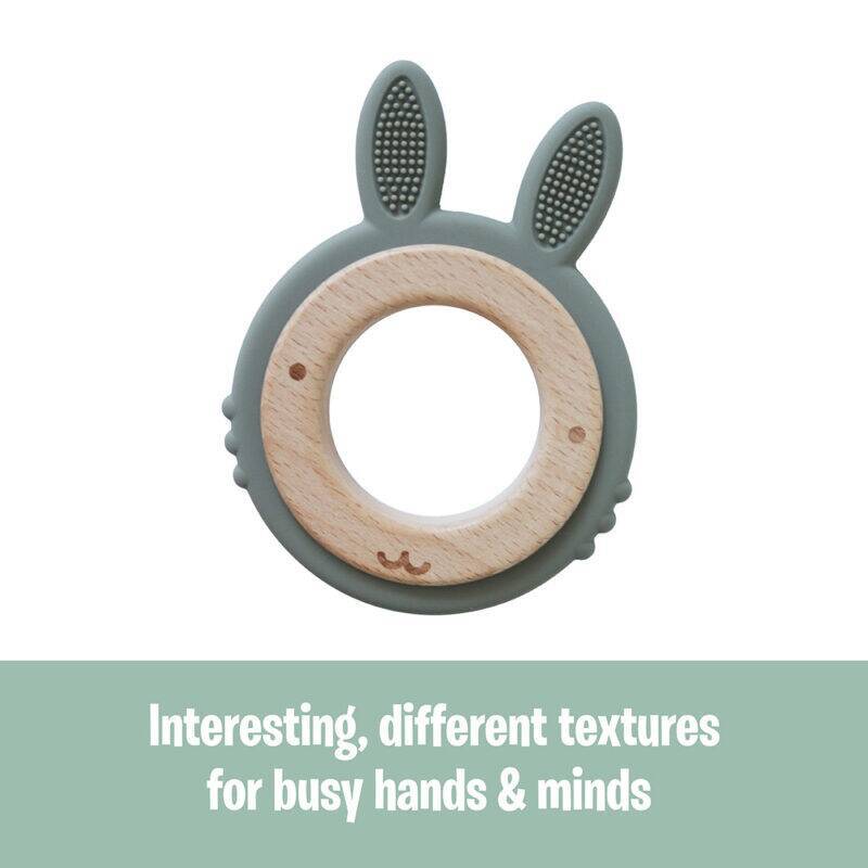 Back To Nature Rabbit Teether Ring in green and pink, featuring varied textures for sensory exploration.