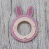 Back To Nature Rabbit Teether Ring in pink and natural wood, featuring textured ears for soothing gums.