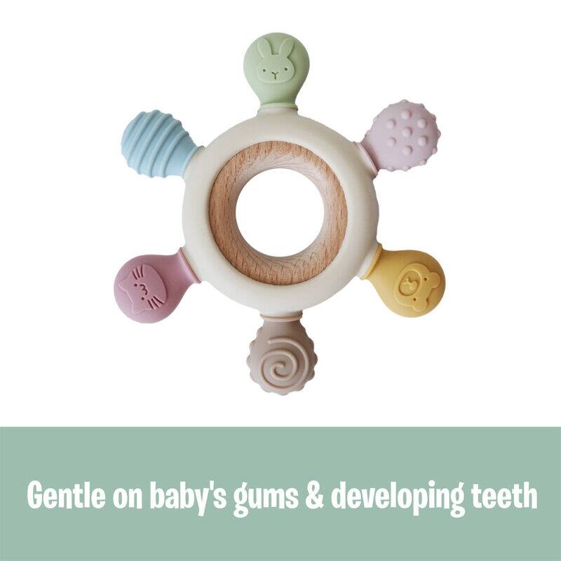 Back To Nature silicone teether with wooden ring, featuring colorful textured shapes for soothing baby's gums.
