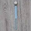 Back To Nature Silicone Pacifier Clip in light blue with a secure metal clip and playful design, set against a wooden