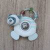 Back To Nature Teether & Spinning Rattle in blue and pink with a bear design and a spinning center filled with beads.