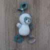 Back To Nature Wiggle & Giggle Pals in blue and pink, featuring a plush animal with a teething ring and clip for easy