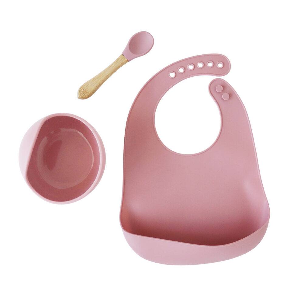 Back To Nature Silicone Feeding Set 3pc in pink includes a bib, bowl, and spoon with a bamboo handle.
