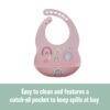 Back To Nature pink silicone bib with rainbow designs and a catch-all pocket for easy cleaning.