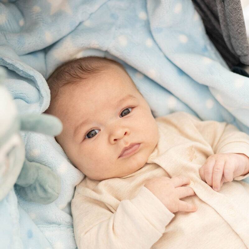 Snuggletime Double Fleece Luxurious Baby Blanket in blue, featuring soft fleece and a cozy design with polka dots.