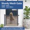 Snuggletime Autolock Retractable Safety Gate in black and gray, featuring a sturdy mesh design with a dog behind it.