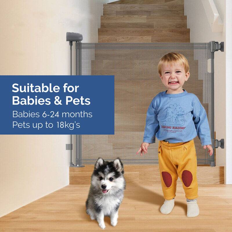 Snuggletime Autolock Retractable Safety Gate in black and gray, shown in a home setting with a child and a small dog.