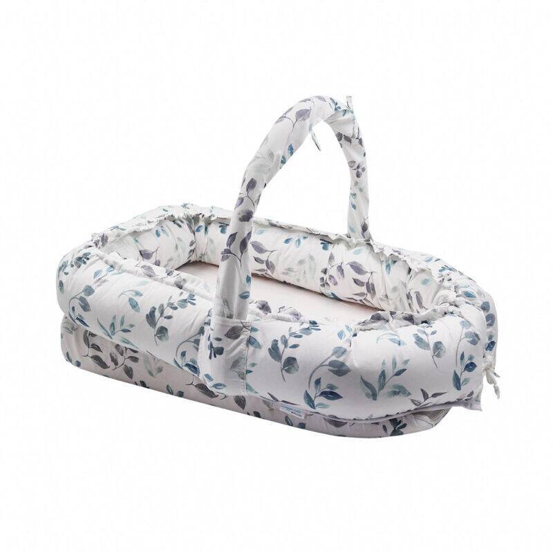 Snuggletime Deluxe Comfort Pod with Activity Arch, featuring a floral design and a soft, padded base for comfort.