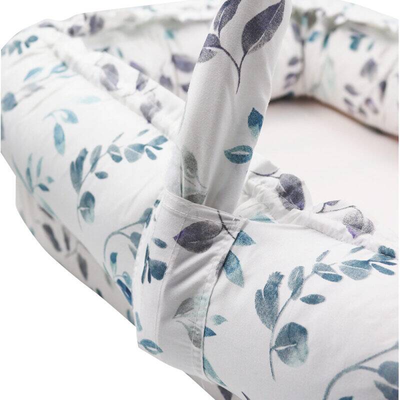 Snuggletime Deluxe Comfort Pod features a floral design, showcasing the soft fabric and raised edges for baby comfort.