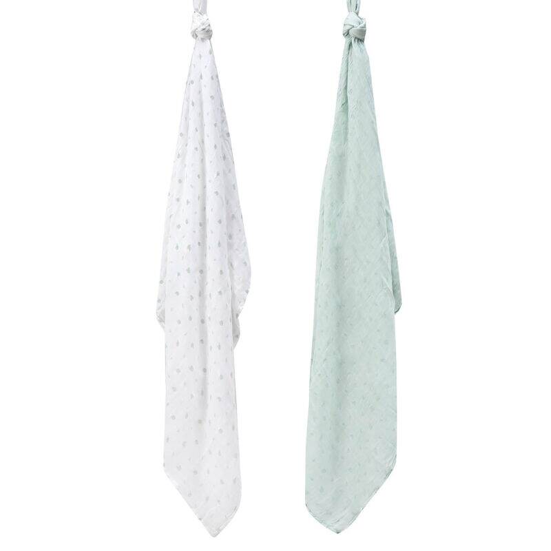 Infancie Bamboo Muslin Blankets 3Pk featuring a white blanket with a subtle pattern and a soft green blanket hanging.