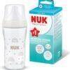 Nuk Perfect Match Glass Bottle 230ml in rainbow style with a white cap and packaging beside it.