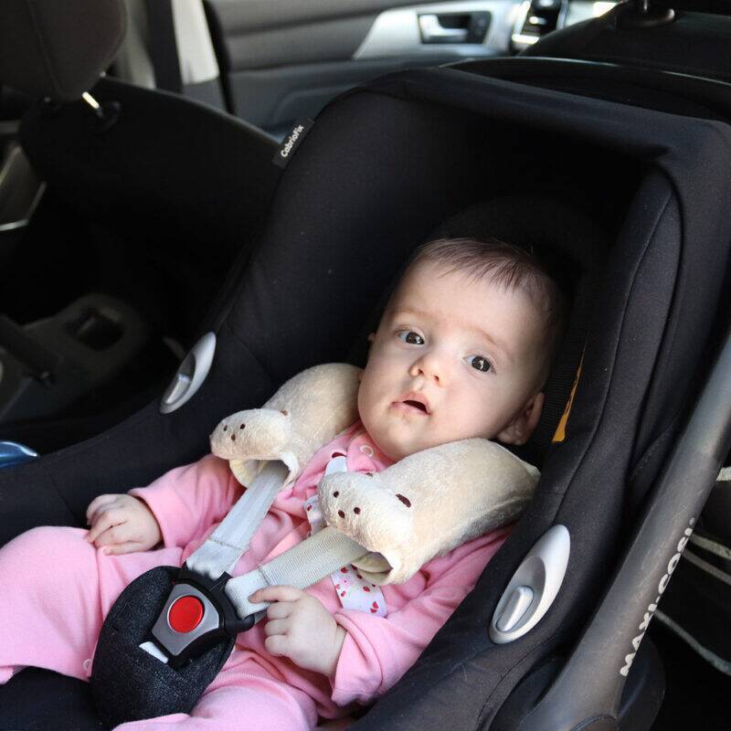 Snuggletime Comfy Straps in a car seat, featuring a baby wearing pink pajamas, providing comfort and support.