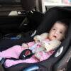 Snuggletime Comfy Straps in a car seat, featuring a baby wearing pink pajamas with soft animal-shaped straps for comfort.