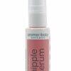 Aromababy Nipple Serum in a pink bottle, featuring a pump dispenser, designed for moms-to-be with avocado and vitamin E.