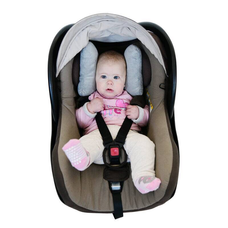 Snuggletime Angelwings Neck Cushion in gray, supporting a baby in a car seat, ensuring comfort and safety.
