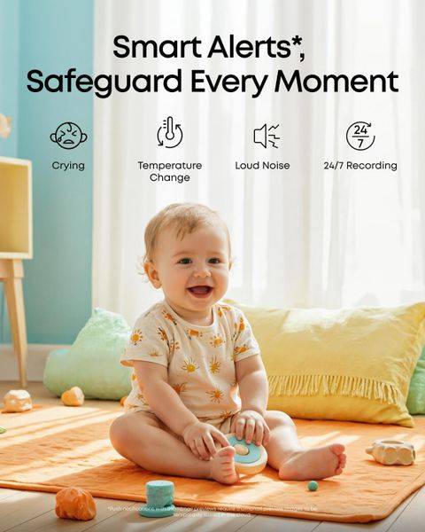 Eufy C10 2K Wireless Smart Baby Monitor displayed in a bright room with a smiling baby sitting on an orange mat.